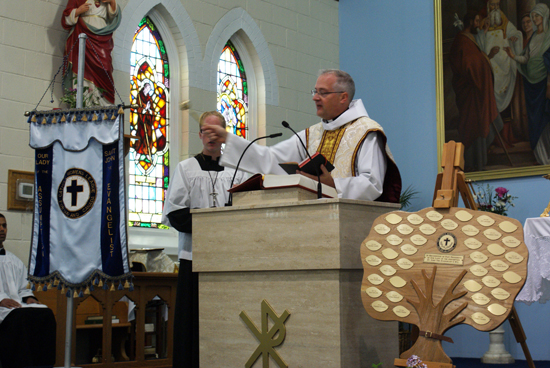 CWL - Father Devereaux blesses CWL banner and unveils plaque