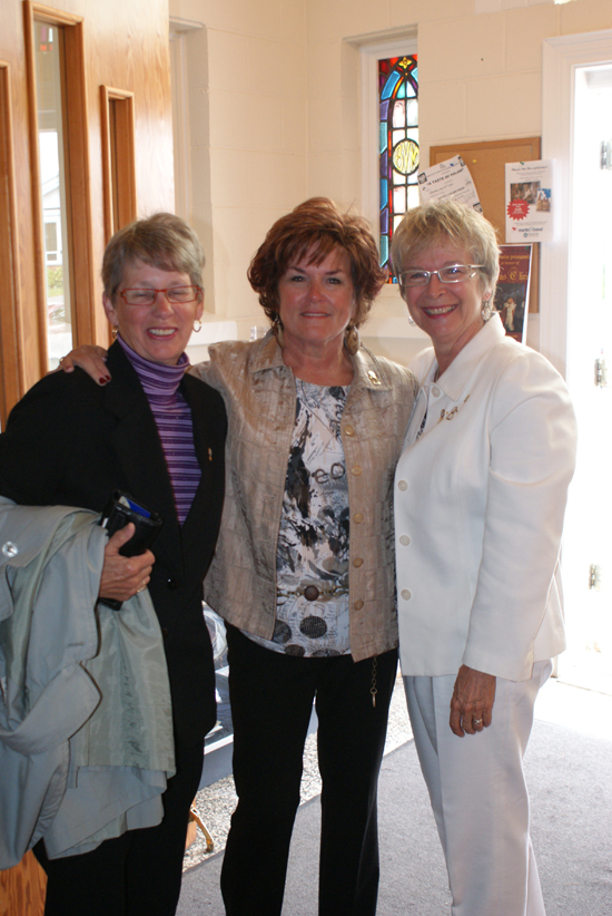 CWL - Greeters Jill Larocque and Sandra O'Toole greet Ruth O'Brien